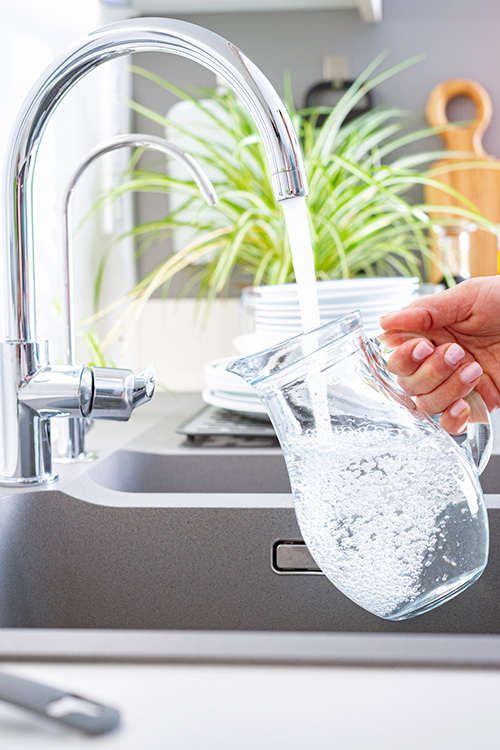 clean-tap-water-2 Pitcher being filled with clean tap water